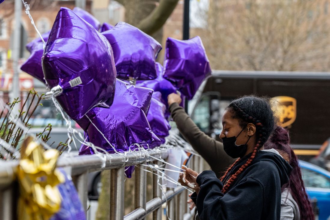 A mourner outside a makeshift vigil for the mother and two daughters killed at Brooklyn birthday party.